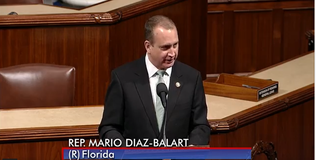 Congressman Diaz-Balart at podium