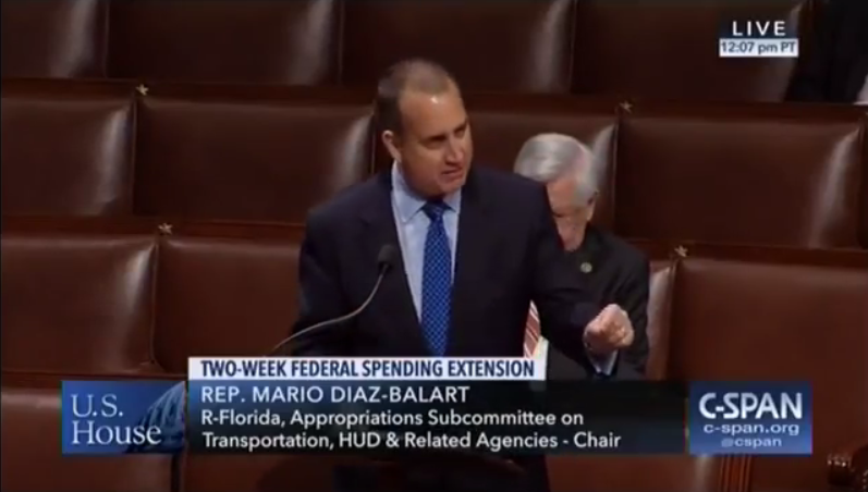 Congressman Diaz-Balart at podium