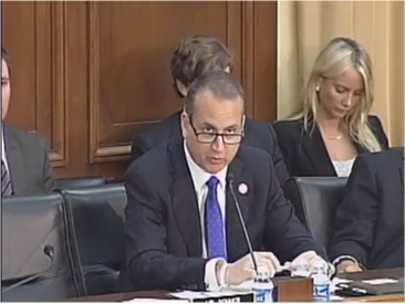 Congressman Diaz-Balart addressing the room