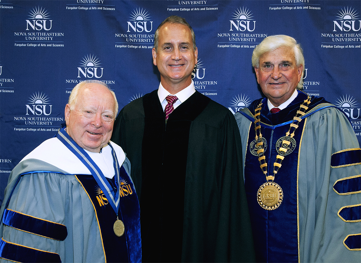 Congressman Diaz-Balart posing with NSU staff