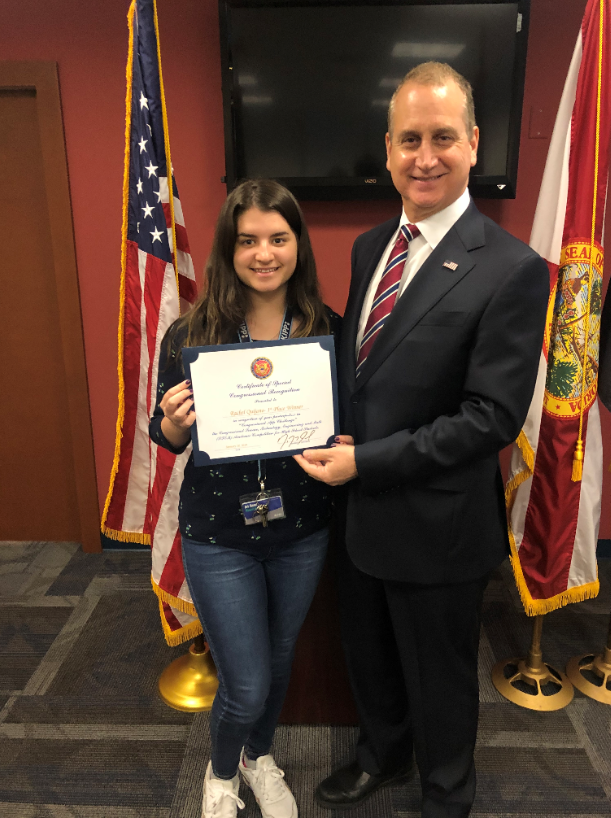 Congressman Diaz-Balart posing with winner