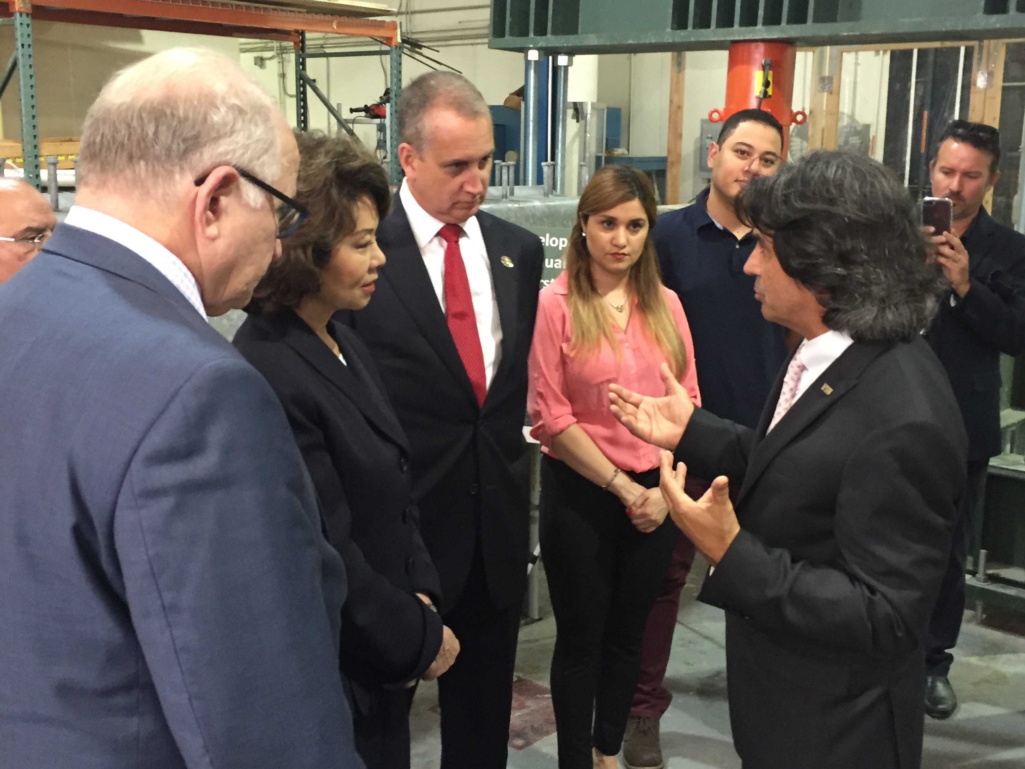 Congressman Diaz-Balart talking to people in the field