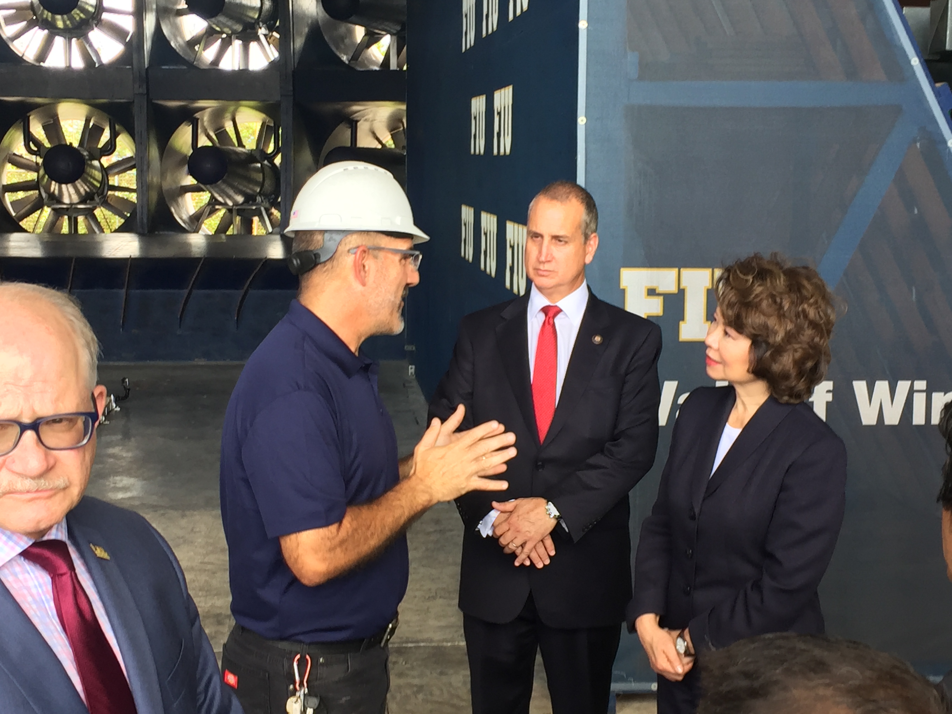 Congressman Diaz-Balart talking to people in the field