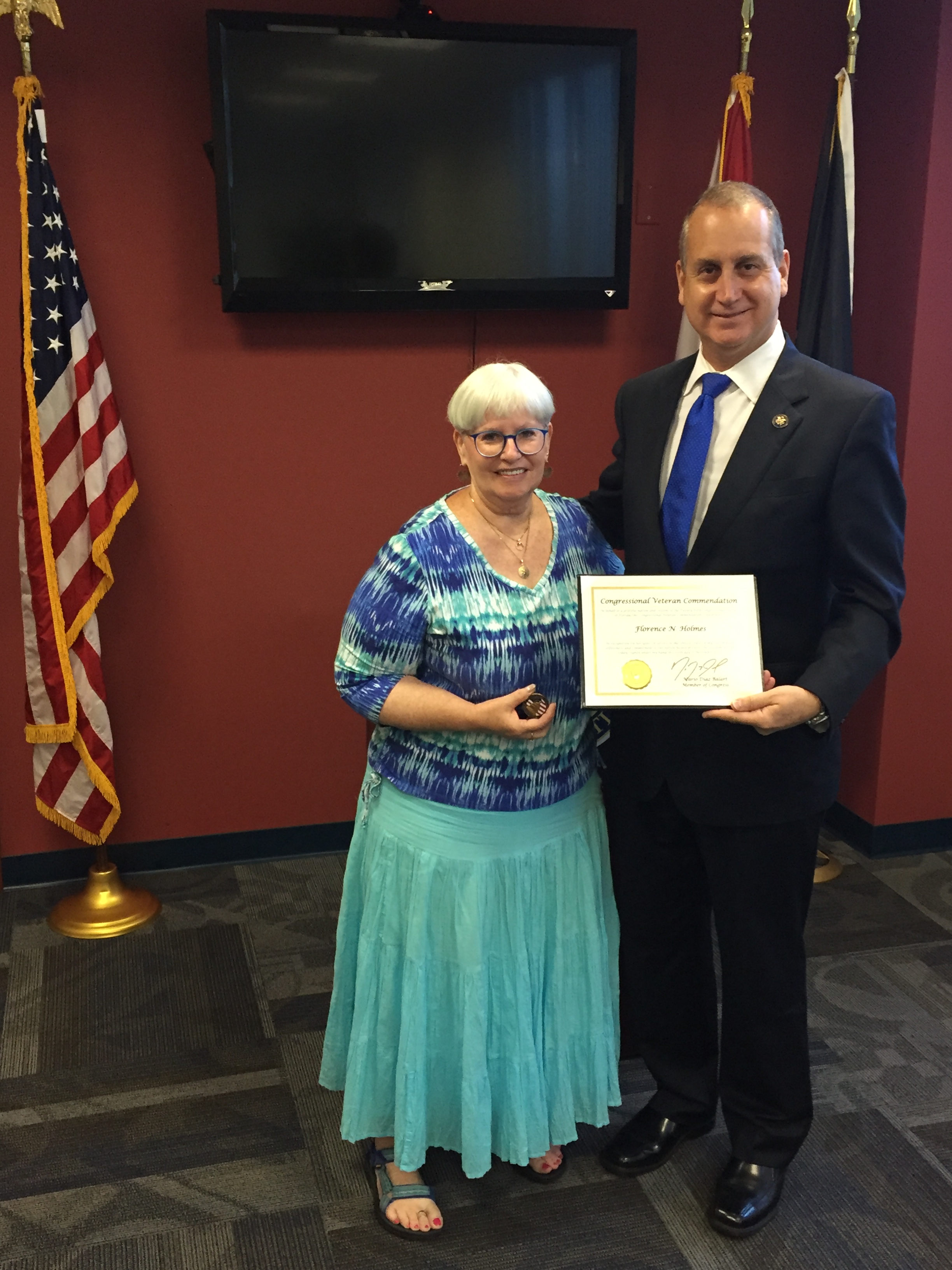 Congressman Diaz-Balart posing with awardee