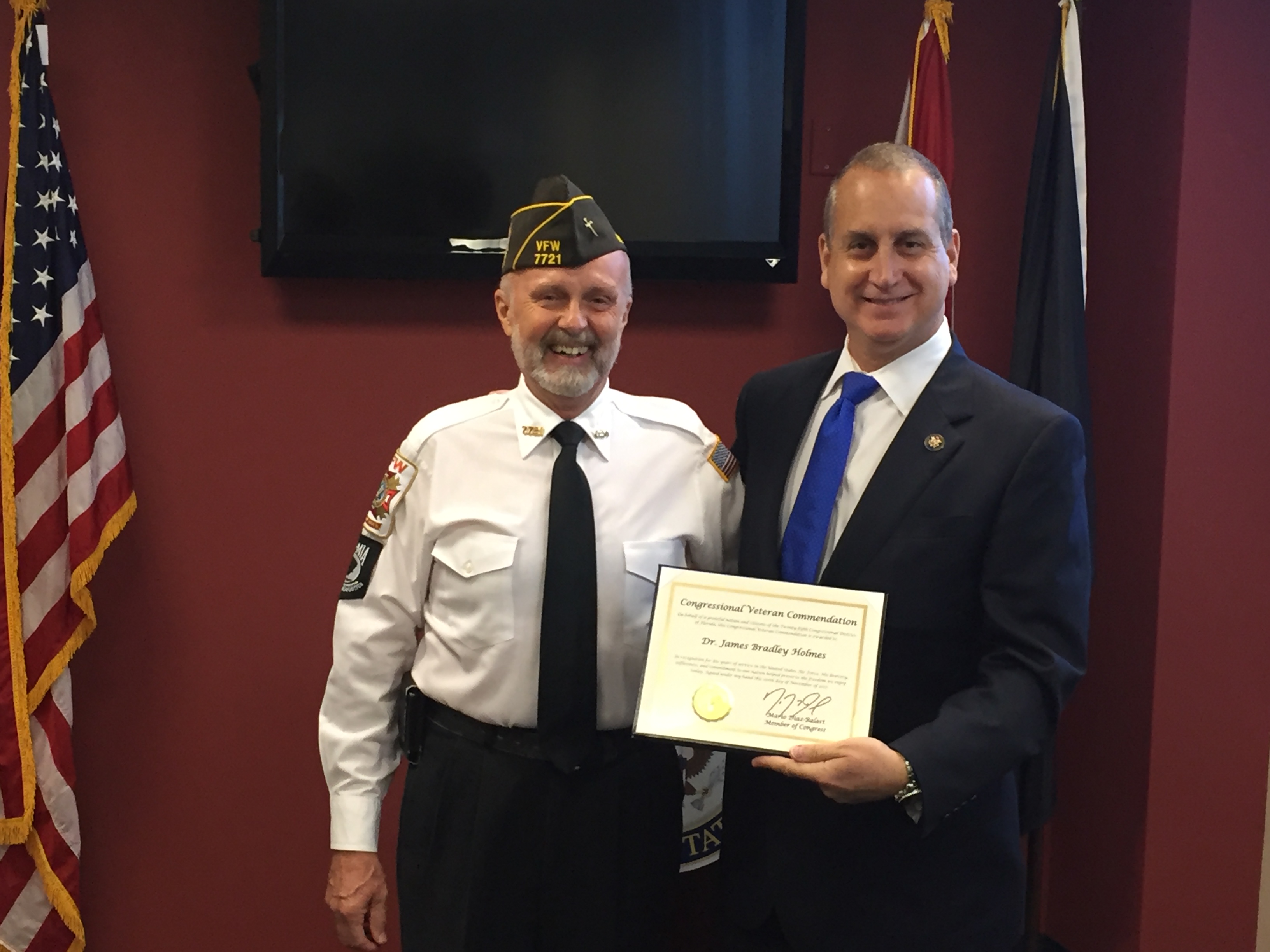 Congressman Diaz-Balart posing with awardee