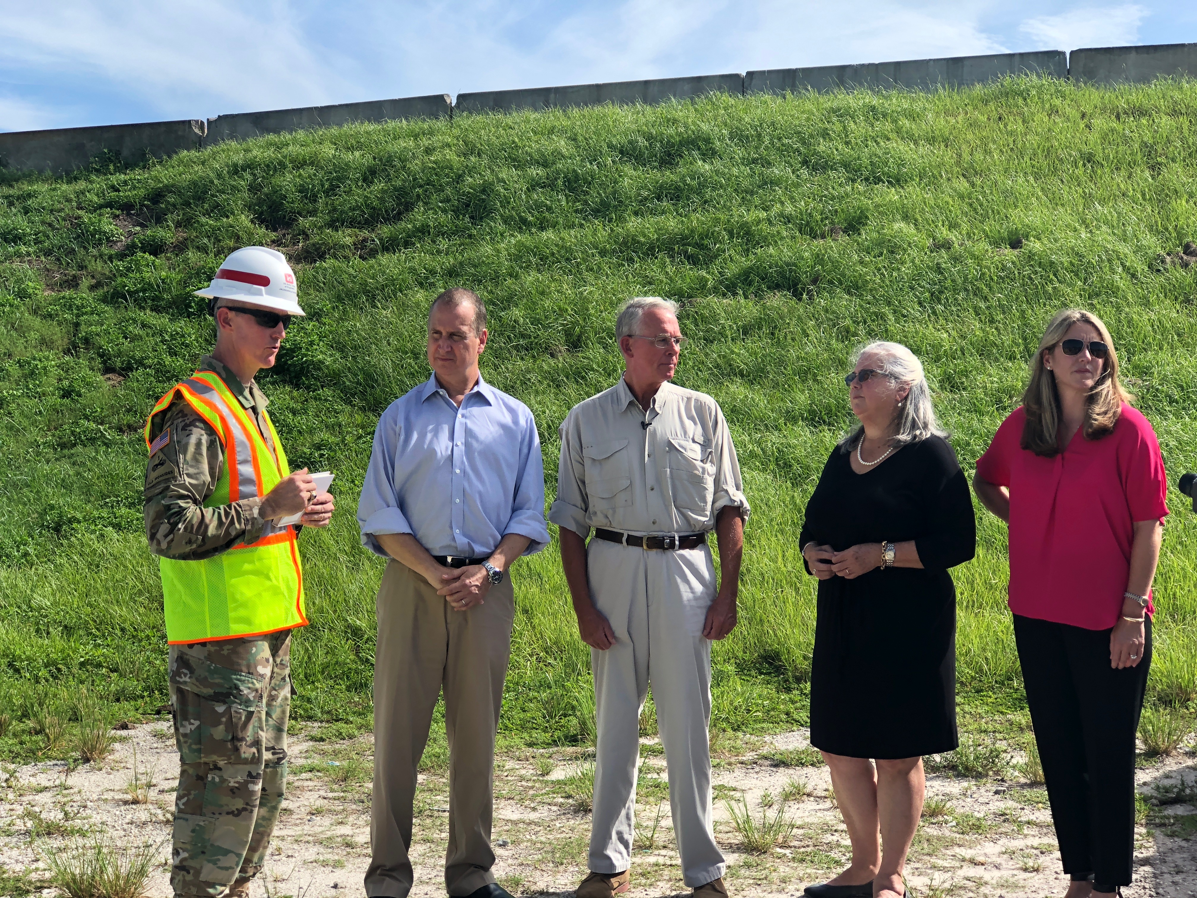 Congressman Diaz-Balart talking to people in the field