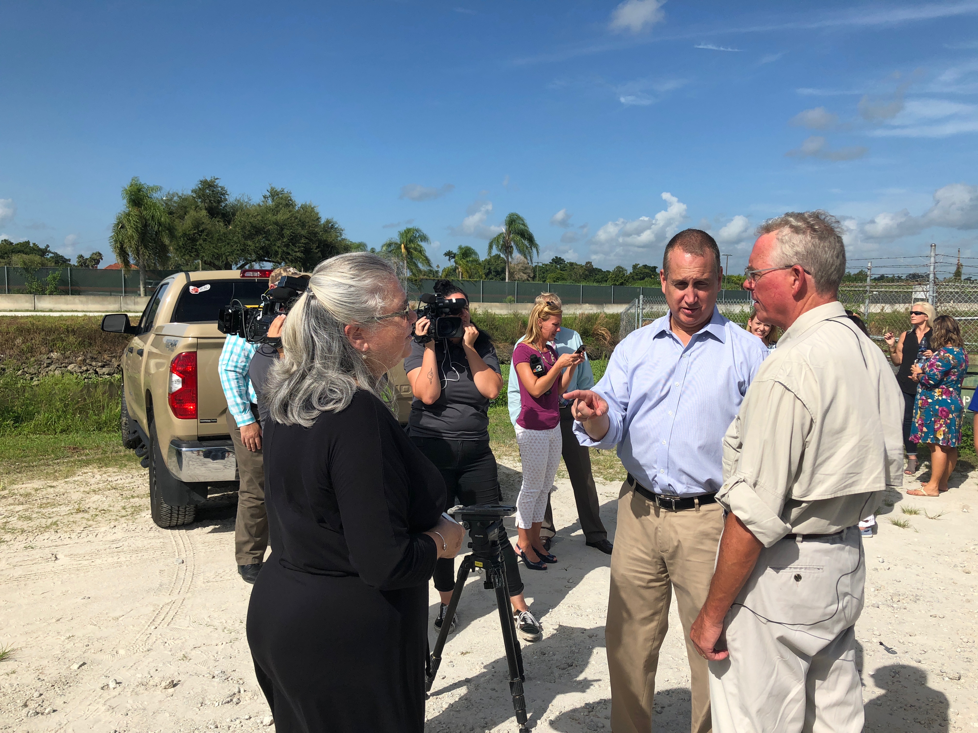 Congressman Diaz-Balart talking to people in the field