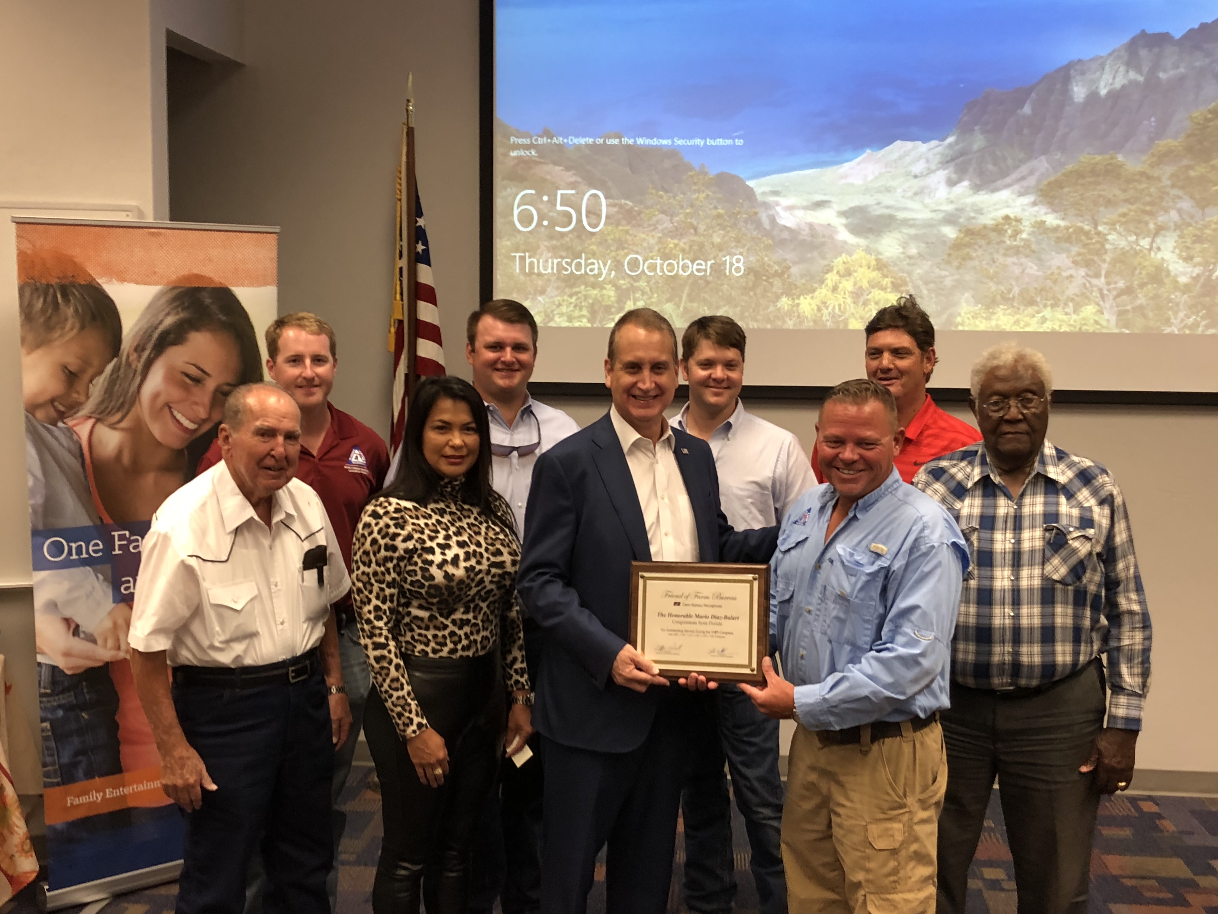 Congressman Diaz-Balart posing with others