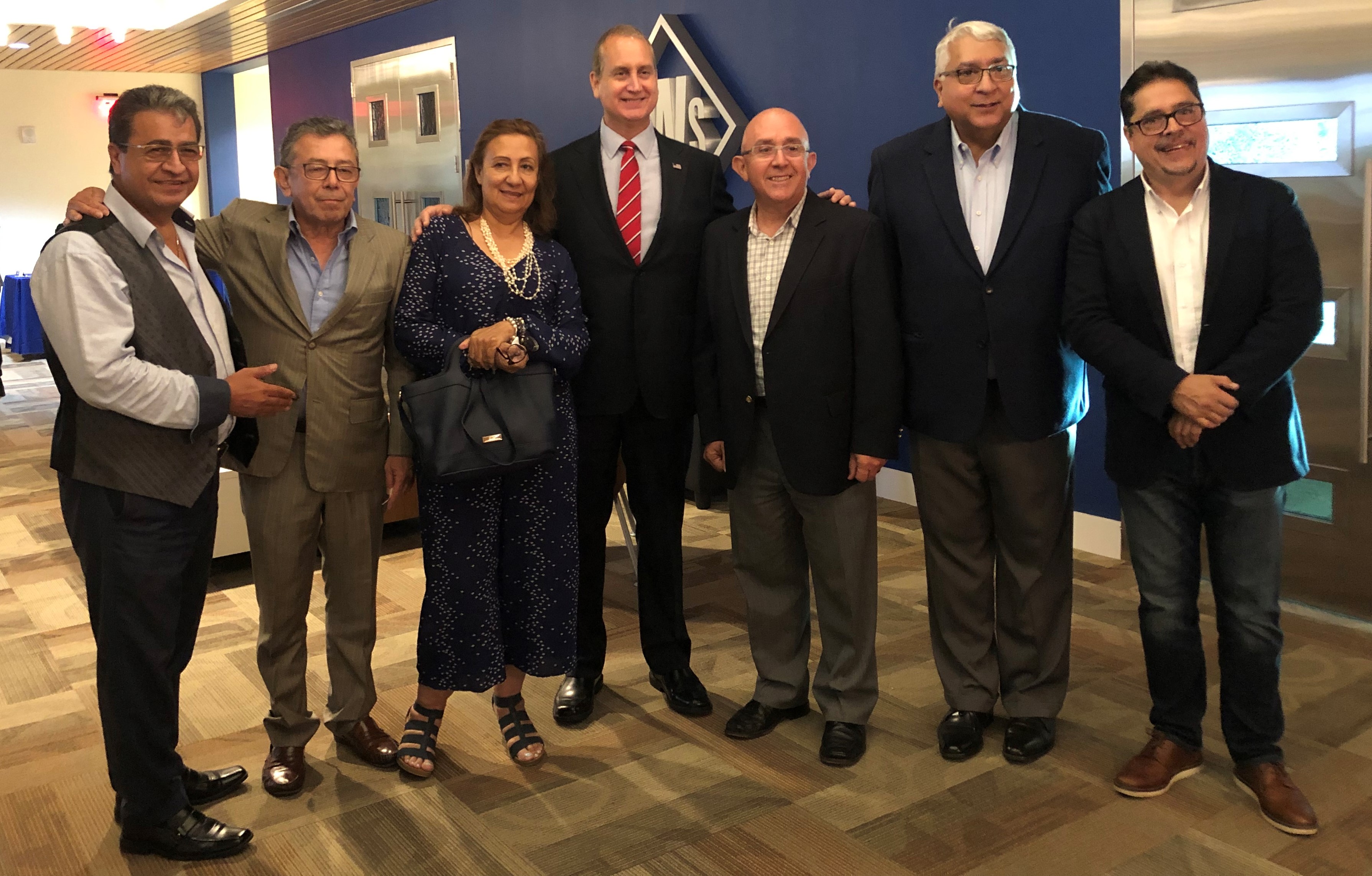 Rep. Diaz-Balart posing with others