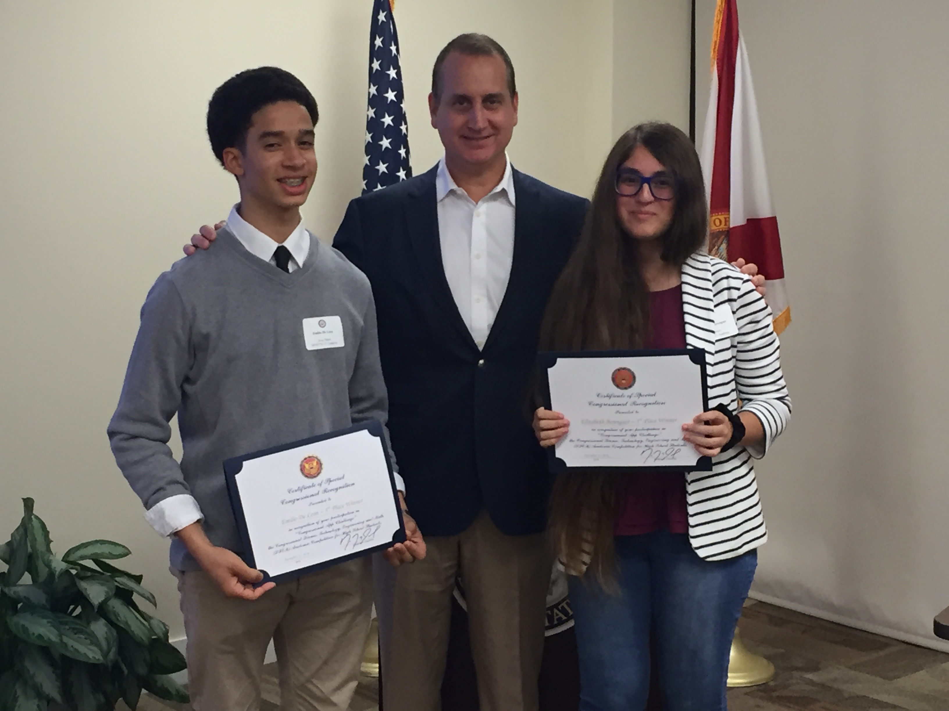 Congressman Diaz-Balart posing with awardees