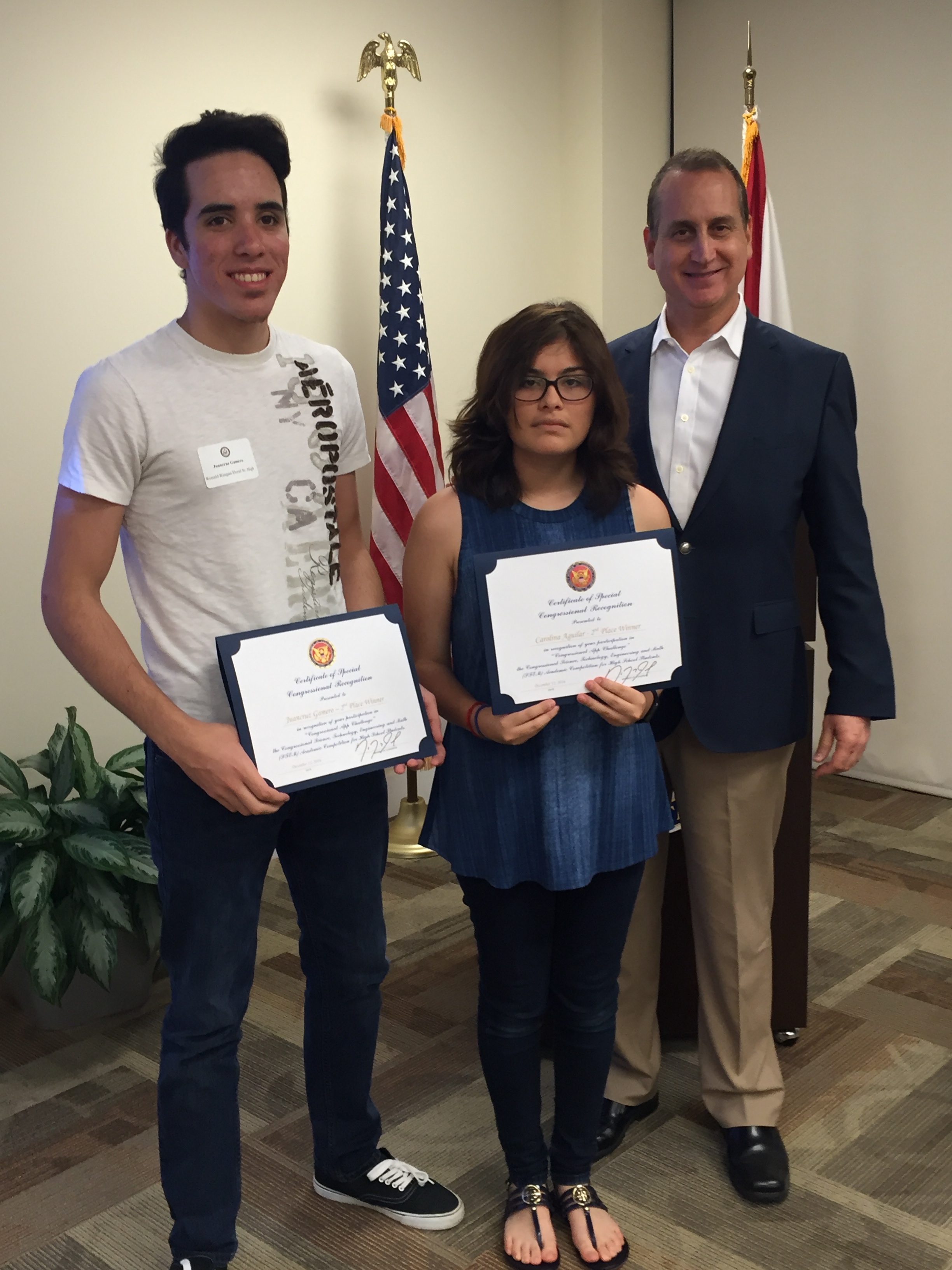 Congressman Diaz-Balart posing with awardees