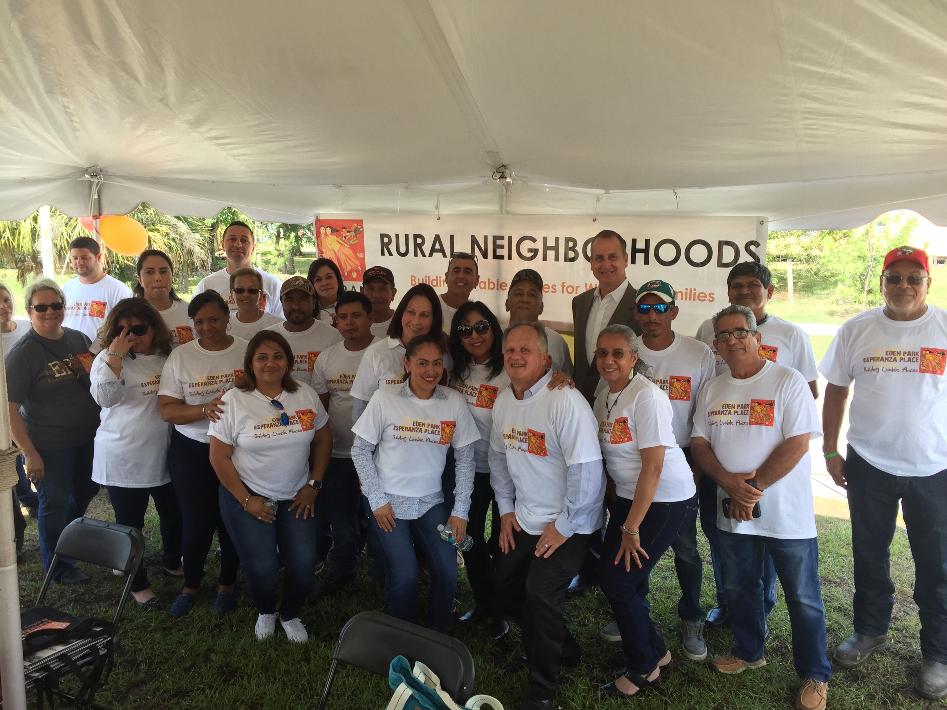 Congressman Diaz-Balart posing with others Rural Neighborhoods nonprofit