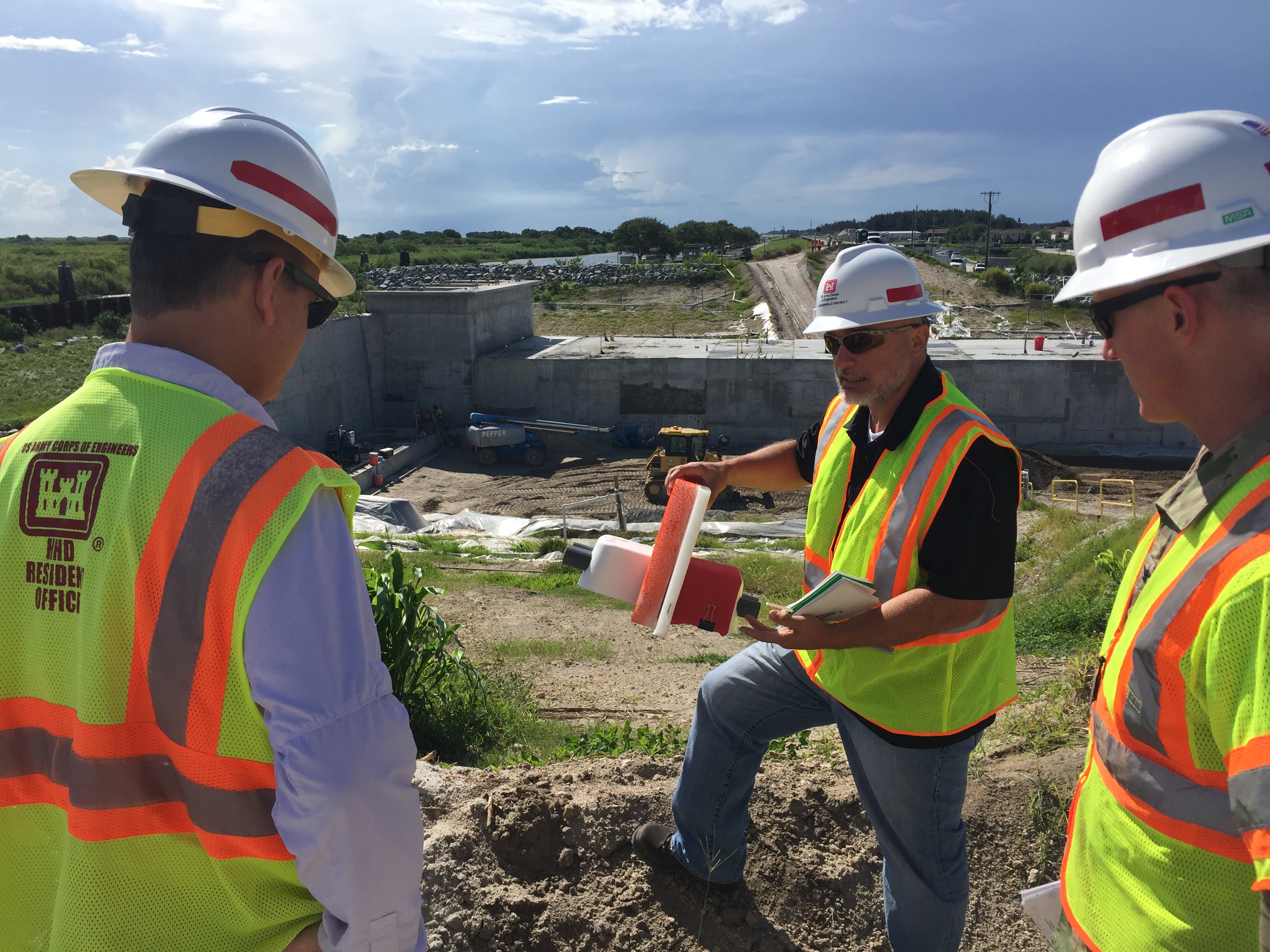 Congressman Diaz-Balart talking with people on site