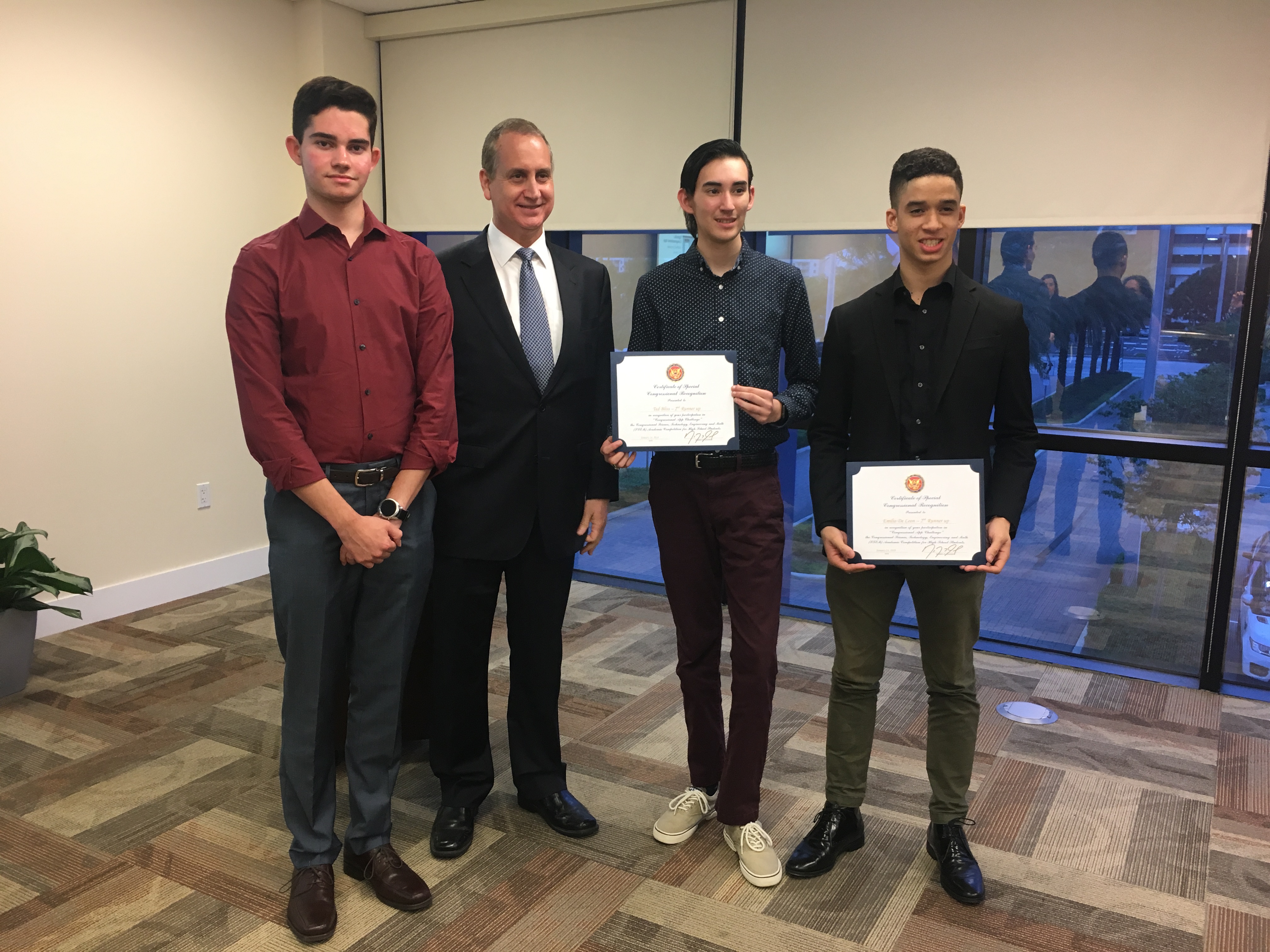 Congressman Diaz-Balart posing with awadees