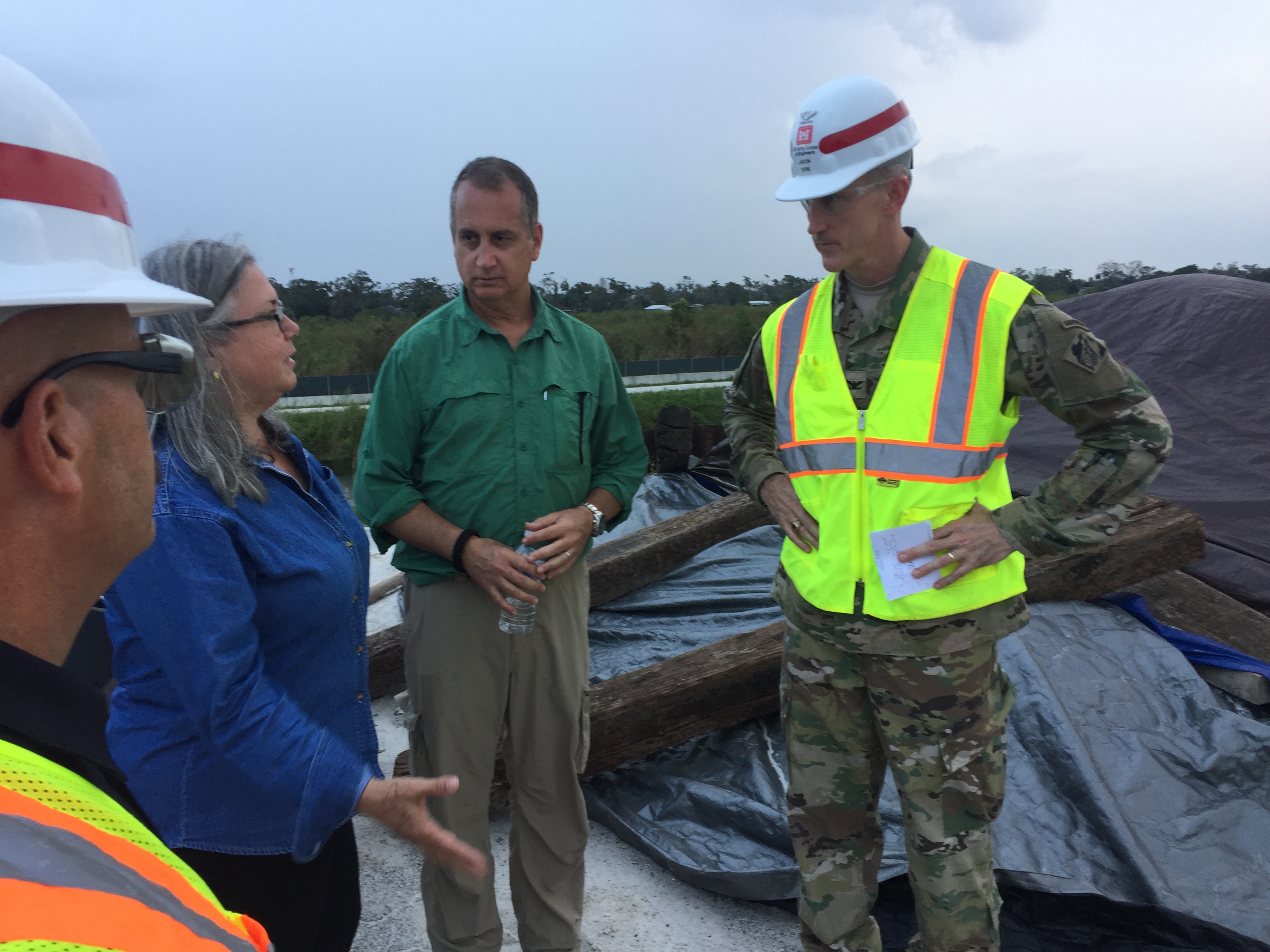 Congressman Diaz-Balart talking to people in the field