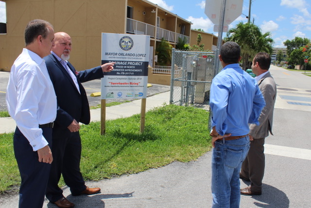 Congressman Diaz-Balart talking to people in the field