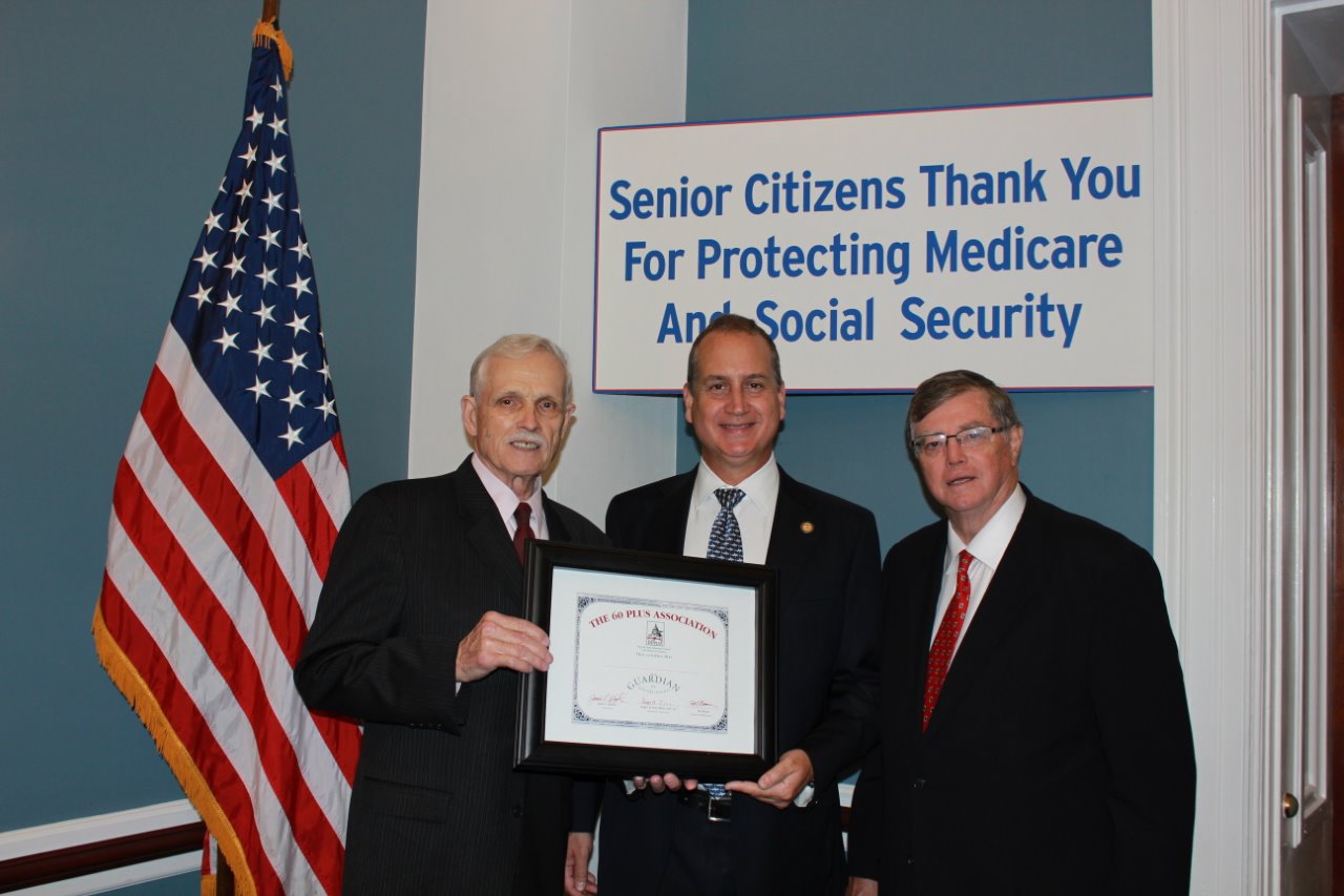 Congressman Diaz-Balart posing with others