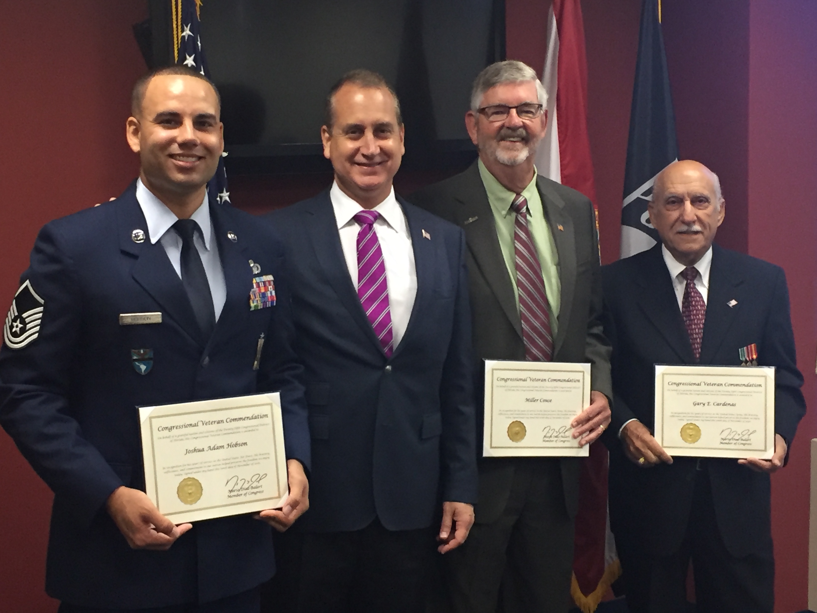 Congressman Diaz-Balart posing with awardees